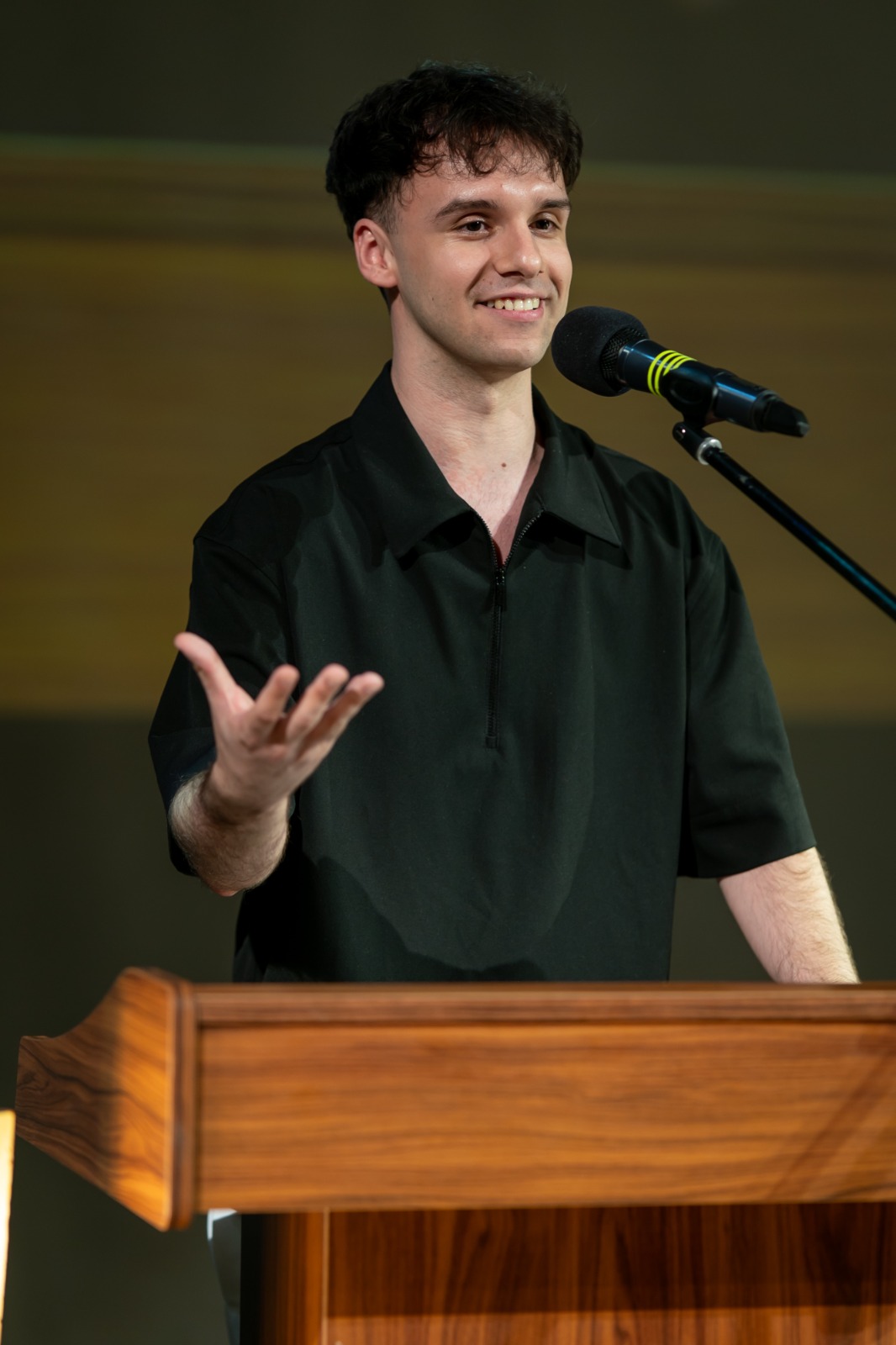 Alin Văduva speaking at a podium
